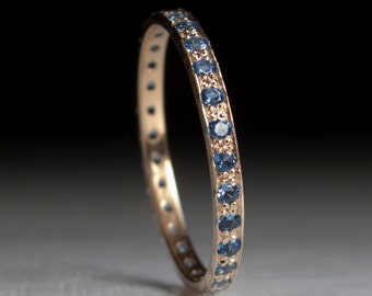 Gold Blue topaz Eternity ring