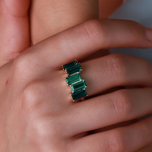 Absolutely gorgeous asymmetrical Emerald baguette ring