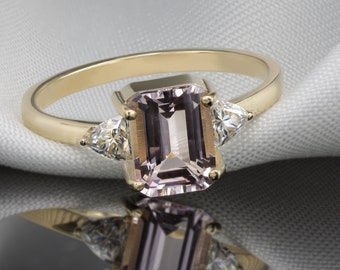 Morganite Gold ring with a pair of trillion cut moissanites