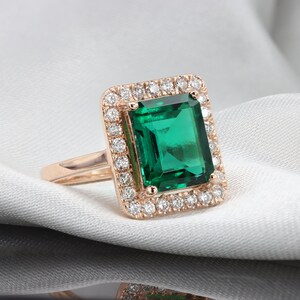 Emerald diamond halo ring image 2
