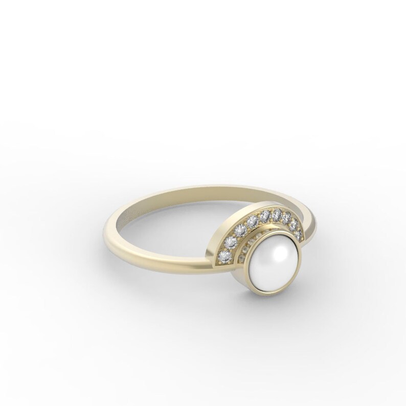 May include: A gold ring with a pearl and a half-circle of diamonds.