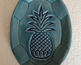 Pineapple hospitality inspired spoon rest hand crafted with custom stamp and fired to 2,232 degrees in home studio kiln. 4' x 6"