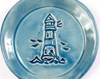 Artisan crafted Lighthouse spoon rest, stoneware pottery stamped image with Sky Blue glaze for eclectic kitchen decor. Also use for tea bag.