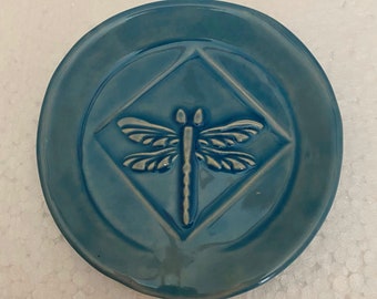 Handcrafted Dragonfly spoon rest 4" round from stoneware clay fired to 2,235 degrees in my home kiln. Sky blue lead free glaze finish.