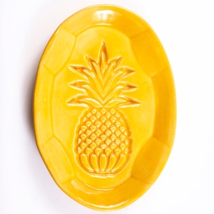 Handmade Pineapple Spoon Rest using custom made pottery stamp then formed and kiln fired at 2,235 degrees in my home studio. Food safe.