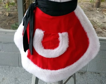 May include: A festive red apron with a white faux fur trim and pocket, resembling a Santa Claus costume. The apron has a black waist tie and is designed to be worn around the waist. The apron is made of a soft, plush material.