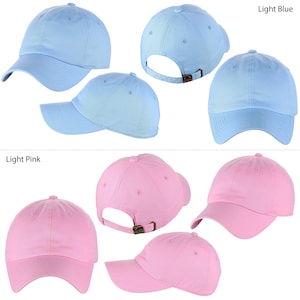 May include: Six blank baseball caps in two colors: light blue and light pink. The caps are shown in different angles, including front, back, and side views.