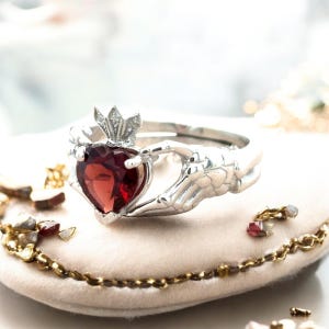 The Lovers Tarot Ring– Skeleton Hands with Mozambique Garnet & Diamonds | Gothic Fine Jewelry | Tarot Collection