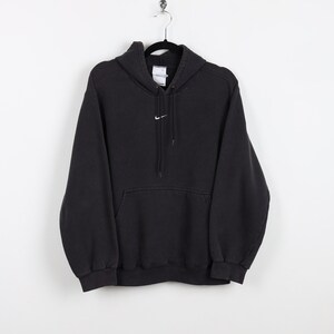Nike hoodie logo sales in the middle