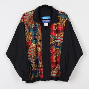 May include: Black windbreaker jacket with a colorful patterned front. The pattern features a red, green, and gold plaid design with floral accents. The jacket has a zipper closure and a stand-up collar.