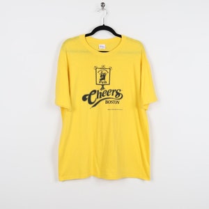 Vintage 80s Cheers Boston 1987 Paramount Pictures Bull Finch Pub Graphic Print Tee Single Stitch Drinking Alcohol Yellow T-shirt Size XL