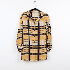 May include: A yellow and black plaid long-sleeved shirt with a button-up front.