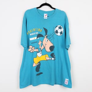 T-1 WORLD CUP 水色 Tシャツ オープンステッチロゴTシャツ[品番：AZLW0023368]｜AZUL BY