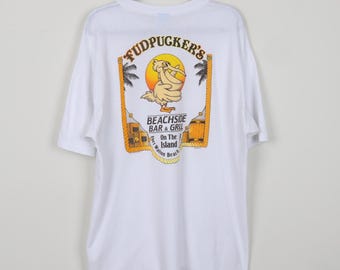 Camiseta vintage de los 90 con el texto "No te han molestado hasta que te han puesto mal", divertida y humorística de FudPucker's Beachside Bar & Grill en la isla, talla XXL.