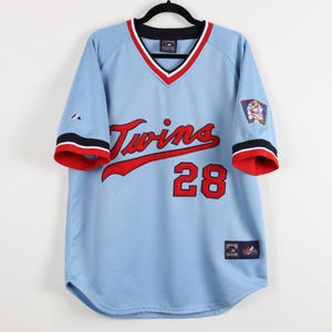 May include: A set of three ceramic nesting bowls in shades of blue, green, and white. The bowls feature a speckled glaze and a simple, modern design. The largest bowl measures approximately 6 inches in diameter.