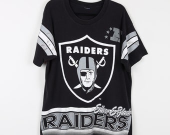 Vintage 90s Oakland Raiders Silver & Black Football Graphic Vintage 90s Oakland Raiders Silver & Black Football Graphic