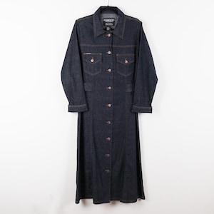 May include: A dark wash denim dress with a button-down front, collared neckline, and long sleeves. The dress features two chest pockets and a label that reads "Rampage". The dress has brown stitching and is hanging on a black hanger.