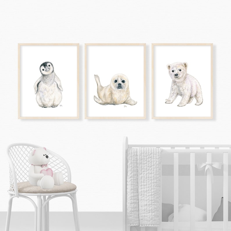 May include: Three framed watercolor illustrations of arctic animals: a penguin, a seal, and a polar bear. The illustrations are in a minimalist style with white backgrounds.