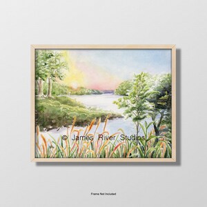 May include: Watercolor painting of a serene lake scene at sunset. The artwork features a wooden frame, with a vibrant sky and lush greenery. The text "James River Studios" is visible.