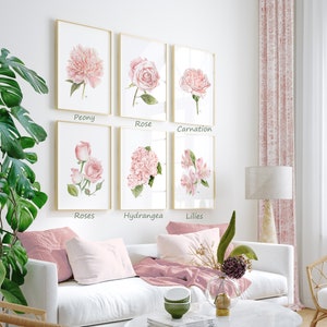 Peut inclure: Six peintures &agrave; l'aquarelle encadr&eacute;es de fleurs roses, chacune avec un type de fleur diff&eacute;rent et le nom de la fleur imprim&eacute; sous l'image. Les fleurs sont la pivoine, la rose, l'&oelig;illet, les roses, l'hortensia et les lys.