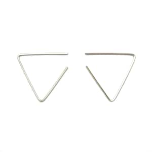 May include: A pair of silver triangle shaped earrings. The earrings are simple and minimalist in design.