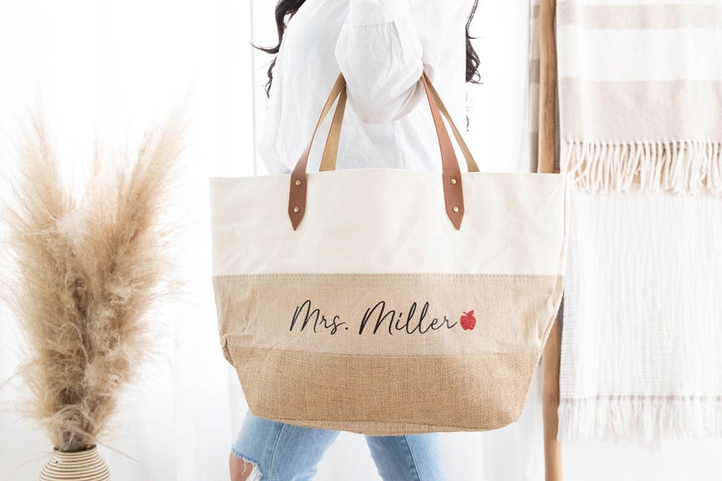 canvas jute burlap layered tote bag with faux leather handles, personalized teacher name, and glitter apple accent