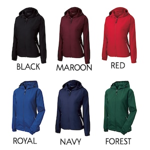May include: Six hooded zip-up jackets in black, maroon, red, royal blue, navy blue, and forest green. Each jacket features a front zipper, long sleeves with elastic cuffs, a hood, and a small white accent detail near the lower side pockets.