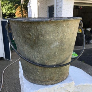 BUCKETS: vintage, heavy steel, galvanized buckets from a 1930’s Brooklyn boatyard in which Capt. Benny’s grandfather worked. 3 available.