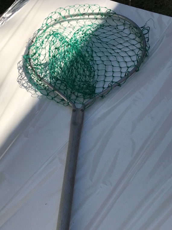 Fish landing net with a long handle. Successful history in bringing in the  big one. Great fishing gear!