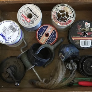 Fishing collection of vintage items. Lime, oarlock, reels