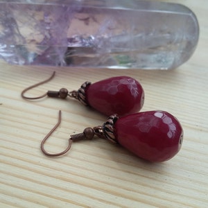 Jade and bronze dangle earrings faceted red jade teardrop stones with brass features