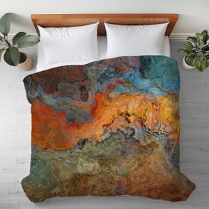 May include: Abstract art duvet cover with swirling patterns in shades of blue, orange, brown, and gray.