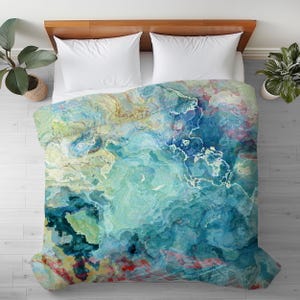 May include: A blue, green, and yellow abstract duvet cover with a marbled pattern.