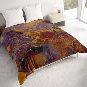 May include: A duvet cover with a colorful abstract design featuring swirling patterns of purple, red, orange, and gold. The duvet cover is made of soft, comfortable fabric and is perfect for adding a touch of modern style to any bedroom.