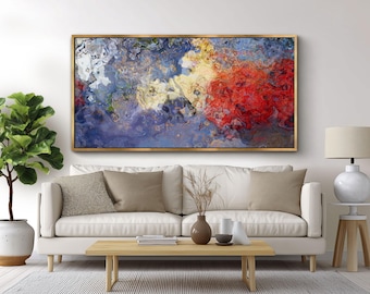 Può includere: Un'opera d'arte murale rettangolare caratterizzata da un design fluido astratto con colori vorticosi di blu profondo, rosso brillante, crema e bianco, racchiusa in una sottile cornice in metallo dorato. L'opera presenta un aspetto marmorizzato.