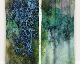 May include: Two-panel curtain set with an abstract design. The curtains feature a blend of blues, greens, and hints of purple, creating a marbled effect. The design is reminiscent of flowing water or geological formations. The curtains are hung on a silver rod.