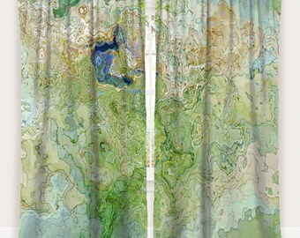 May include: Two green and blue abstract patterned curtains with the words "Panel 1" and "Panel 2" at the top.
