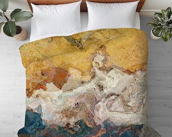 Può includere: Copripiumino astratto con un motivo marmoreo giallo, arancione, marrone, bianco e blu.