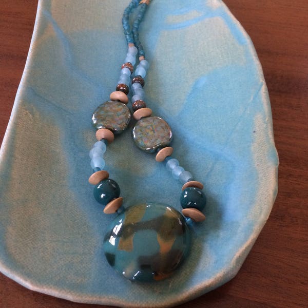 Blue-green Kazuri bead, glass, and wood necklace