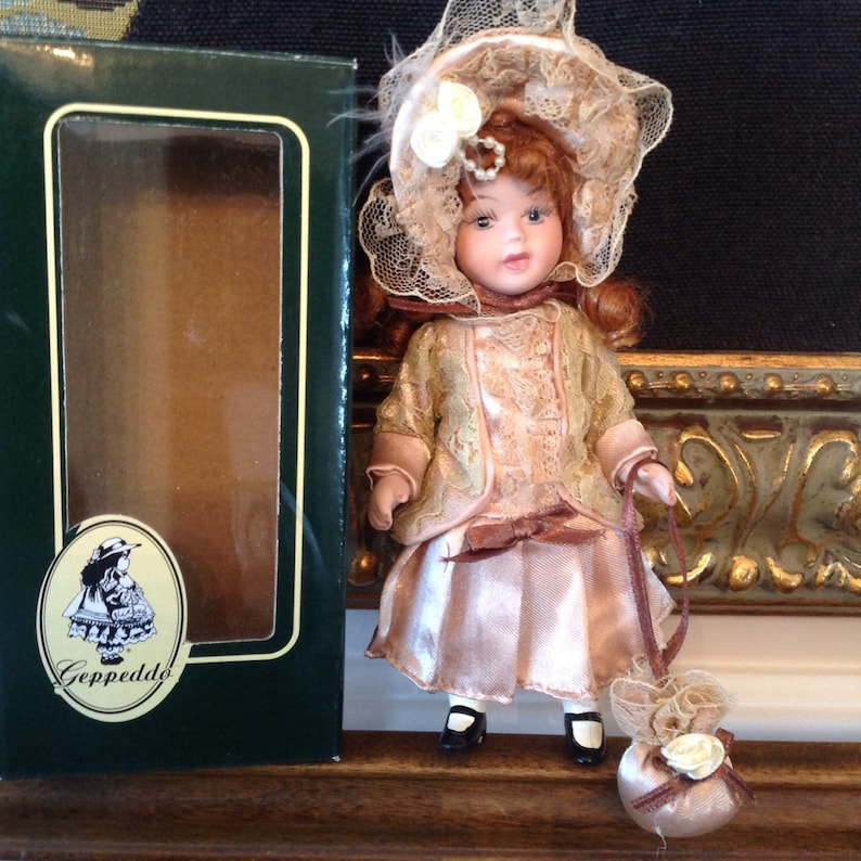 Geppeddo Victorian porcelain doll beautiful red lockets Etsy