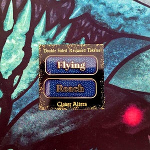 May include: A pair of double-sided keyword tokens with the words "Flying" and "Reach" in gold lettering. The tokens have a blue background with white dots and are labeled "Clover Alters."