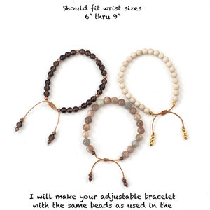 May include: Three adjustable bracelets with round beads in dark brown, cream, and multi-colored grey tones. Each features a brown cord with sliding knot closure and small accent beads at the ends. Text reads: Example of adjustable bracelets. Should fit wrist sizes 6" thru 9". I will make your adjustable bracelet with the same beads as used in the stretch bracelet adding small beads on the cord ends.