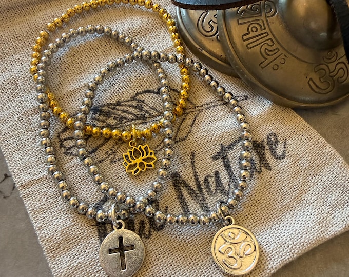 Metal Stretch Charm Bracelet: Lotus, OM, Cross