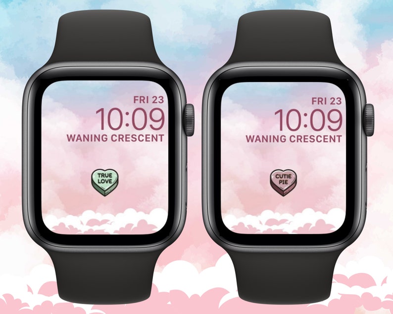May include: Two black Apple Watch Series 7 smartwatches with pink and blue watercolor backgrounds. The watch faces display the time as 10:09, the date as FRI 23, and the moon phase as "WANING CRESCENT". One watch face has a candy heart with the text "TRUE LOVE" and the other has a candy heart with the text "CUTIE PIE".