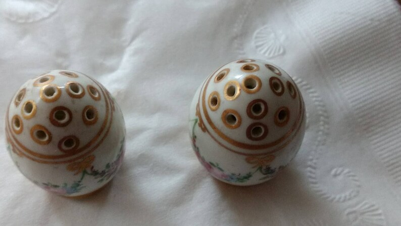 Dresden Bone China Salt and Pepper in Gold Trim with a Floral Motif.