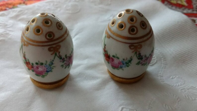 Dresden Bone China Salt and Pepper in Gold Trim with a Floral Motif.