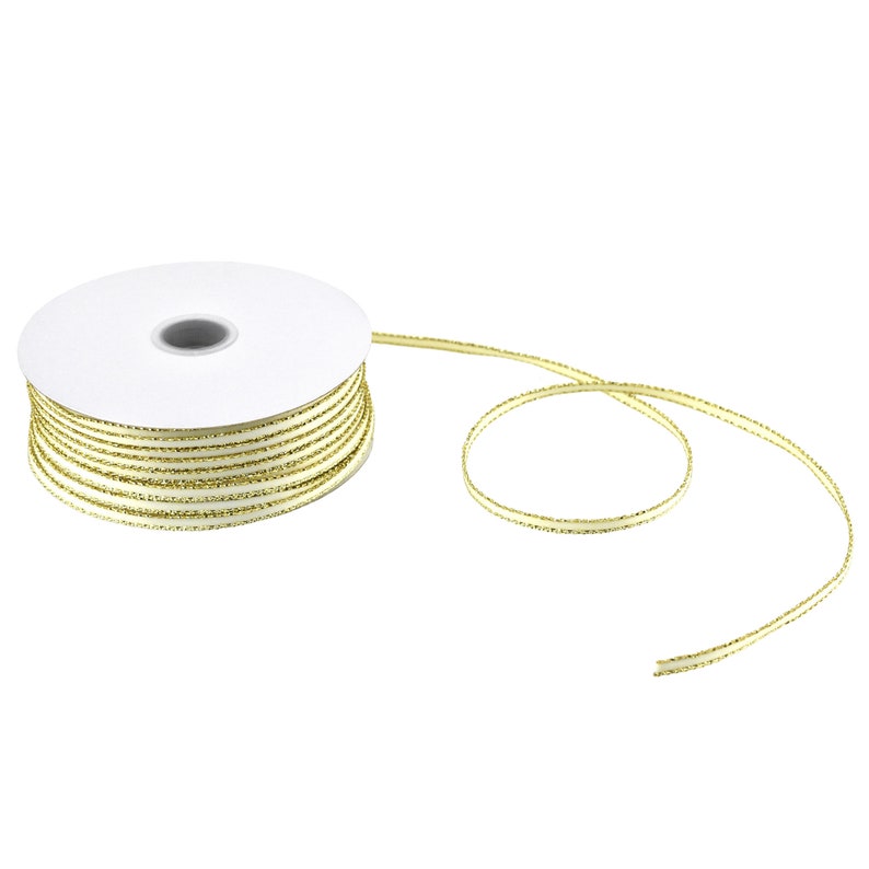 May include: A spool of ivory satin ribbon with a gold metallic edge. The ribbon is wound around a white cardboard spool.