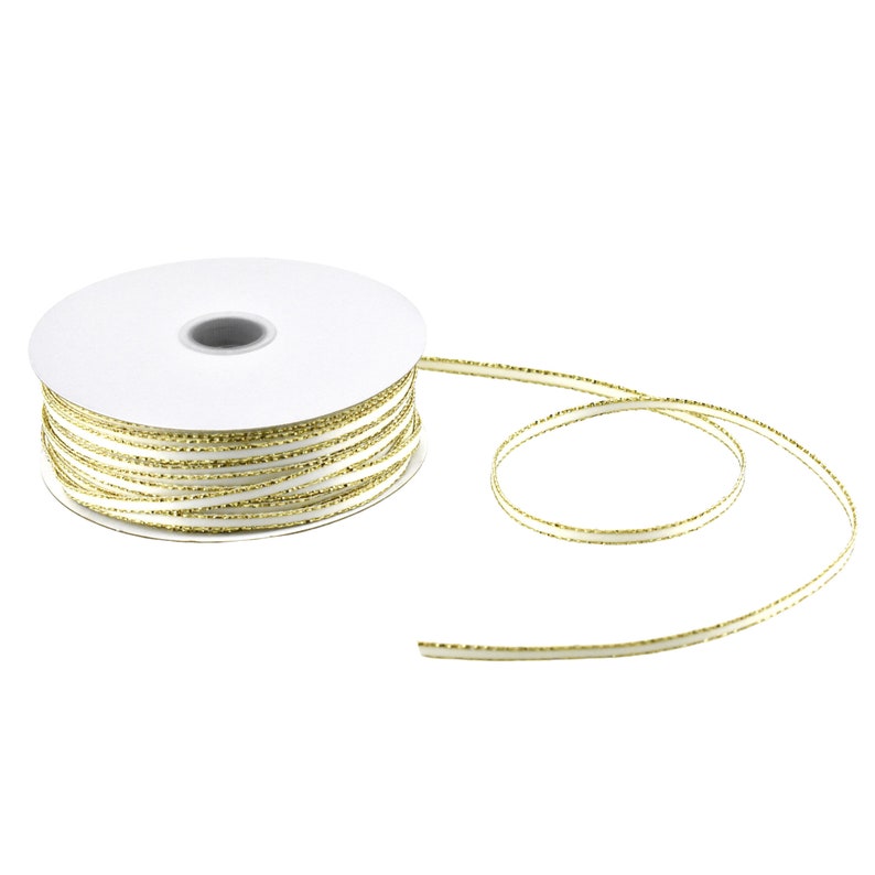 May include: A spool of white satin ribbon with a gold metallic edge. The ribbon is wound around a white cardboard spool.