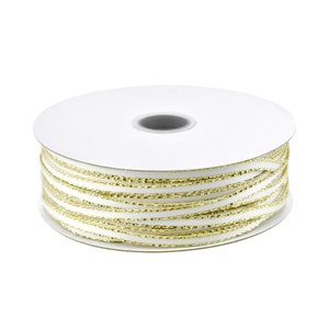 May include: A spool of white ribbon with gold metallic thread running through it.