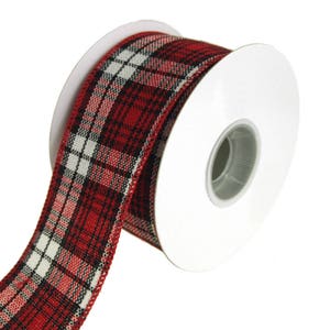May include: A spool of red, black, and white plaid ribbon. The ribbon is wrapped around a white cardboard spool. The plaid pattern is a classic design, suitable for various crafting and decorative purposes.